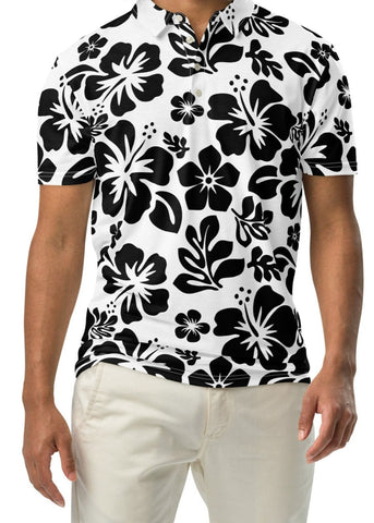 A man wearing a black and white Hawaiian aloha polo shirt with a button-up neck and short sleeves.