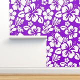 white hawaiian hibiscus flowers on purple wallpaper